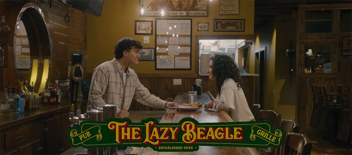 Man serving woman plate at The Lazy Beagle Grille